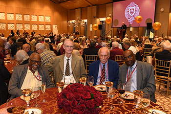 A group of men sitting at a table