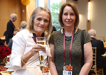 Two women smiling. Links to Gifts That Protect Your Assets